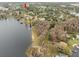 Aerial view of lakefront property and neighborhood at 13721 Mill Pl, Odessa, FL 33556