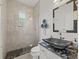 Modern bathroom featuring a black vessel sink and glass shower at 13721 Mill Pl, Odessa, FL 33556