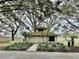 Quaint community building nestled among lush landscaping at 13721 Mill Pl, Odessa, FL 33556