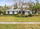 Beautiful one-story home with mature landscaping and a large front yard at 13721 Mill Pl, Odessa, FL 33556