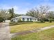 Single-story home with landscaping and driveway at 13721 Mill Pl, Odessa, FL 33556