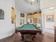 Game room with pool table and built-in entertainment center at 13721 Mill Pl, Odessa, FL 33556