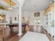 Game room with a pool table, built-in shelving, and hardwood floors at 13721 Mill Pl, Odessa, FL 33556