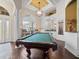 Game room featuring a pool table and hardwood floors at 13721 Mill Pl, Odessa, FL 33556
