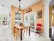 Kitchen features breakfast table and access to backyard at 13721 Mill Pl, Odessa, FL 33556