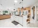 Open concept kitchen with large island and stainless steel appliances at 13721 Mill Pl, Odessa, FL 33556