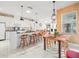Open concept kitchen with island and white cabinets at 13721 Mill Pl, Odessa, FL 33556