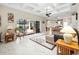 Open living space with pool access and kitchen view at 13721 Mill Pl, Odessa, FL 33556