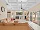 Spacious living room with fireplace and pool view at 13721 Mill Pl, Odessa, FL 33556