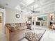 Living room boasts high ceilings and a cozy sectional at 13721 Mill Pl, Odessa, FL 33556