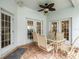 Covered patio with table and chairs, adjacent to the house at 13721 Mill Pl, Odessa, FL 33556