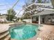 Refreshing screened pool and spa with brick pavers at 13721 Mill Pl, Odessa, FL 33556