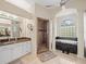 Primary bathroom with soaking tub, separate shower, and double vanity at 13721 Mill Pl, Odessa, FL 33556