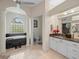 Primary bathroom with soaking tub, walk-in shower, and double vanity at 13721 Mill Pl, Odessa, FL 33556