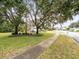 Mature trees and sidewalks line this quiet street at 13721 Mill Pl, Odessa, FL 33556