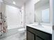 Bathroom features a shower/tub combo and vanity at 14506 Whitewater Way, Brooksville, FL 34604