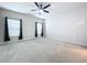 Large bedroom with ceiling fan and carpet at 14506 Whitewater Way, Brooksville, FL 34604