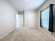 Spacious bedroom with carpeted floor and window at 14506 Whitewater Way, Brooksville, FL 34604