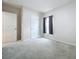 Bright bedroom with neutral wall and carpet at 14506 Whitewater Way, Brooksville, FL 34604
