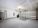 Garage with open garage door and storage at 14506 Whitewater Way, Brooksville, FL 34604