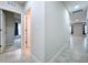 Clean hallway with tile floors and access to bedrooms at 14506 Whitewater Way, Brooksville, FL 34604