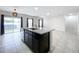 Modern kitchen features granite countertops and an island at 14506 Whitewater Way, Brooksville, FL 34604