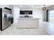 Open kitchen with island, stainless steel appliances, and granite countertops at 14506 Whitewater Way, Brooksville, FL 34604