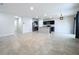 Open kitchen with island, stainless steel appliances, and tile flooring at 14506 Whitewater Way, Brooksville, FL 34604