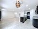 Open living area with tile floors and kitchen access at 14506 Whitewater Way, Brooksville, FL 34604