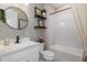 Charming bathroom with patterned wallpaper and a bathtub at 18879 Sailors Delight Pass, Land O Lakes, FL 34638