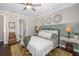 Comfortable bedroom with access to en-suite bathroom and lots of natural light at 18879 Sailors Delight Pass, Land O Lakes, FL 34638