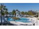 Resort-style pool with multiple areas and palm trees at 18879 Sailors Delight Pass, Land O Lakes, FL 34638