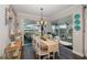 Elegant dining room features a farmhouse table and access to a relaxing patio at 18879 Sailors Delight Pass, Land O Lakes, FL 34638