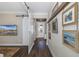 Elegant entry hall with sliding barn door and hardwood floors at 18879 Sailors Delight Pass, Land O Lakes, FL 34638