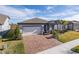 Single story home with covered porch and paver driveway at 18879 Sailors Delight Pass, Land O Lakes, FL 34638