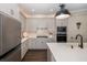 Modern kitchen features stainless steel appliances and an island with quartz countertops at 18879 Sailors Delight Pass, Land O Lakes, FL 34638