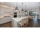 Bright kitchen with white cabinets, quartz countertops, and a view of dining area at 18879 Sailors Delight Pass, Land O Lakes, FL 34638