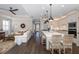 Open concept kitchen and living area with island and hardwood floors at 18879 Sailors Delight Pass, Land O Lakes, FL 34638