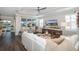 Comfortable living room with sectional sofa, fireplace, and large TV at 18879 Sailors Delight Pass, Land O Lakes, FL 34638