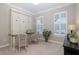 Cozy office with a built-in murphy bed and wicker chairs at 18879 Sailors Delight Pass, Land O Lakes, FL 34638