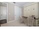 Home office with a murphy bed, built-in desk, and two chairs at 18879 Sailors Delight Pass, Land O Lakes, FL 34638