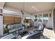 Cozy screened patio with comfortable seating and an outdoor kitchen at 18879 Sailors Delight Pass, Land O Lakes, FL 34638