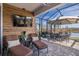 Relaxing screened patio with lounge chairs and a view of the lake at 18879 Sailors Delight Pass, Land O Lakes, FL 34638