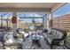 Relaxing screened patio with wicker furniture and a view of the lake at 18879 Sailors Delight Pass, Land O Lakes, FL 34638