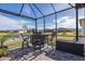 Enjoy the view from this screened patio with bar seating at 18879 Sailors Delight Pass, Land O Lakes, FL 34638