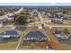 Aerial view of a single-Gathering home and surrounding neighborhood at 4372 Odin St, Spring Hill, FL 34608