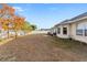 Large backyard with a tree and patio area at 4372 Odin St, Spring Hill, FL 34608