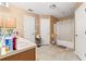Bathroom with double vanity, shower, and linen closet at 4372 Odin St, Spring Hill, FL 34608