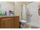 Clean bathroom with a shower/tub combo and wood vanity at 4372 Odin St, Spring Hill, FL 34608