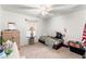 Simple bedroom with a bed, dresser and ceiling fan at 4372 Odin St, Spring Hill, FL 34608